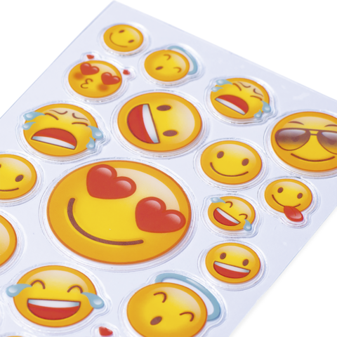 Eine Sammlung von verschiedenen Emoji-Stickern, darunter lachende Gesichter, Herzen und Sonnenbrillen-Emojis auf einem weißen Hintergrund.