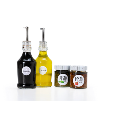 Drei Flaschen mit Pflegeprodukten: eine lila Flasche mit Pumpe, eine weiße Flasche und eine gelbe Flasche, beschriftet mit "Shampoo" und "Dusche Creme".